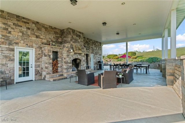 9627 State Route 152, Richmond, OH 43944 - view of patio / terrace with an outdoor stone fireplace