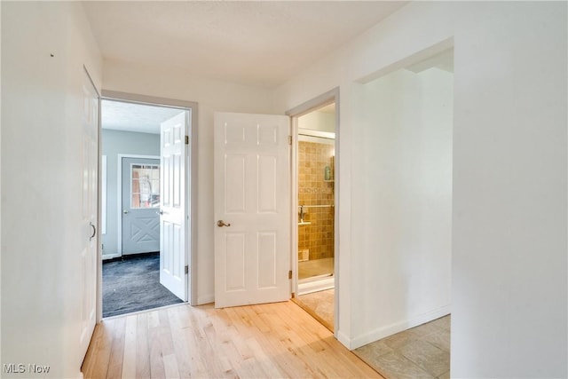 4944 Coleman Dr, Akron, OH 44319 - hallway with light wood finished floors and baseboards