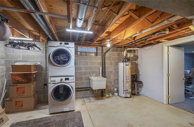 425 Woodlake Dr, Medina, OH 44256 - washroom with gas water heater and stacked washer / dryer