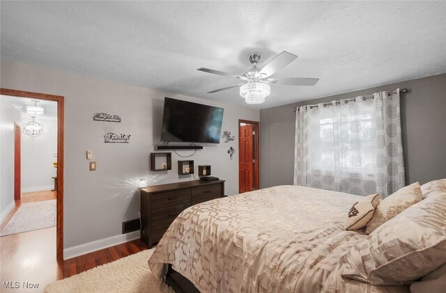 425 Woodlake Dr, Medina, OH 44256 - bedroom with wood finished floors, baseboards, and a ceiling fan
