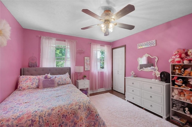 425 Woodlake Dr, Medina, OH 44256 - bedroom featuring a ceiling fan, a closet, and wood finished floors