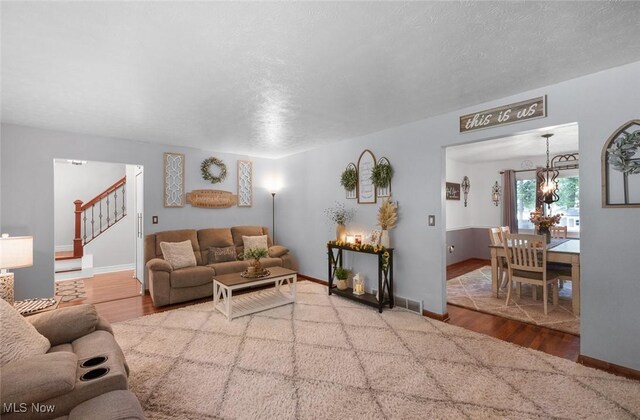 425 Woodlake Dr, Medina, OH 44256 - living area featuring stairs, wood finished floors, and baseboards