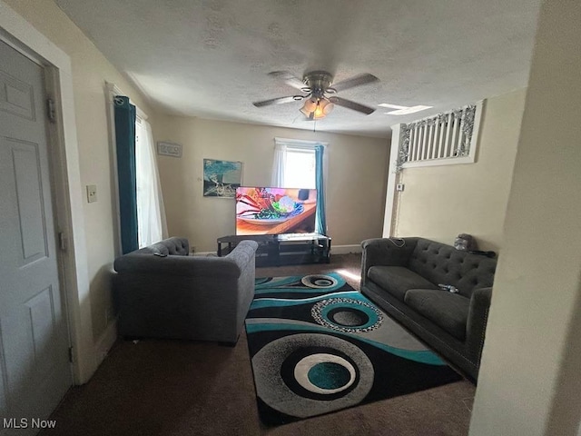 2411 Strasser Pl SW, Canton, OH 44710 - carpeted living room with a ceiling fan, baseboards, and a textured ceiling