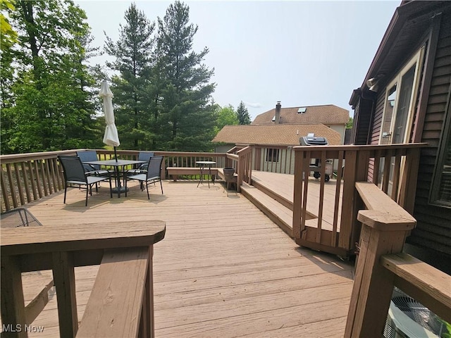6671 Queens Way N, Royalton, OH 44133 - deck with outdoor dining area and a grill