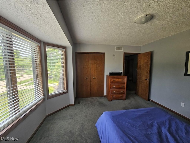6671 Queens Way N, Royalton, OH 44133 - carpeted bedroom featuring a textured ceiling, a closet, and baseboards