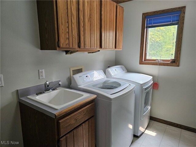 6671 Queens Way N, Royalton, OH 44133 - laundry area featuring cabinet space, washing machine and dryer, and baseboards