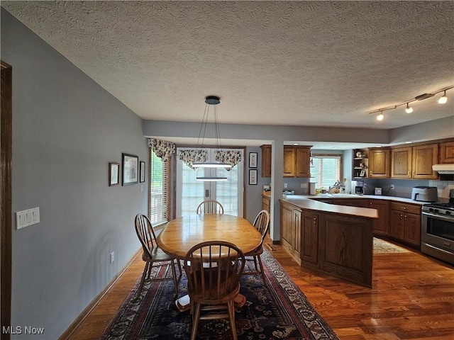 6671 Queens Way N, Royalton, OH 44133 - dining space featuring wood finished floors and a textured ceiling
