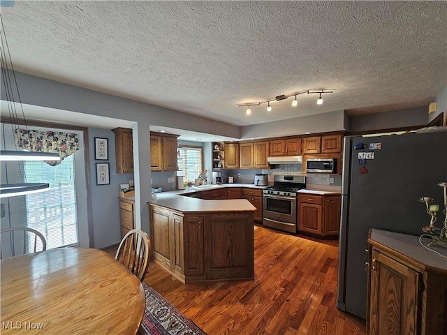 6671 Queens Way N, Royalton, OH 44133 - kitchen featuring stainless steel appliances, a sink, wood finished floors, under cabinet range hood, and open shelves