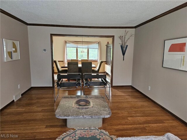 6671 Queens Way N, Royalton, OH 44133 - dining space with a textured ceiling, crown molding, dark wood-style floors, and baseboards