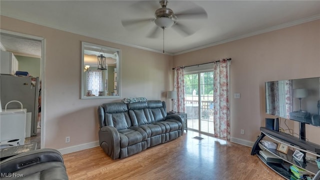 21 E Maple Ave, New Concord, OH 43762 - living area featuring ceiling fan, wood finished floors, baseboards, and ornamental molding