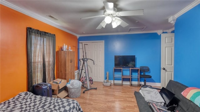 21 E Maple Ave, New Concord, OH 43762 - bedroom with ornamental molding, wood finished floors, attic access, baseboards, and a ceiling fan