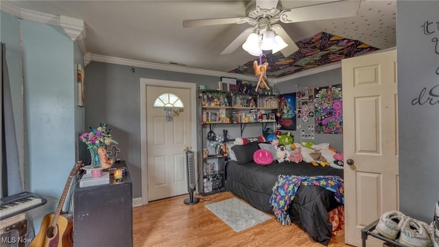 21 E Maple Ave, New Concord, OH 43762 - bedroom with ornamental molding, wood finished floors, and ceiling fan