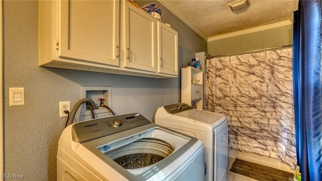 21 E Maple Ave, New Concord, OH 43762 - washroom featuring independent washer and dryer, ornamental molding, a textured wall, cabinet space, and a textured ceiling