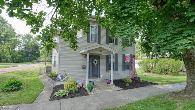 21 E Maple Ave, New Concord, OH 43762 - view of front of home featuring a front yard