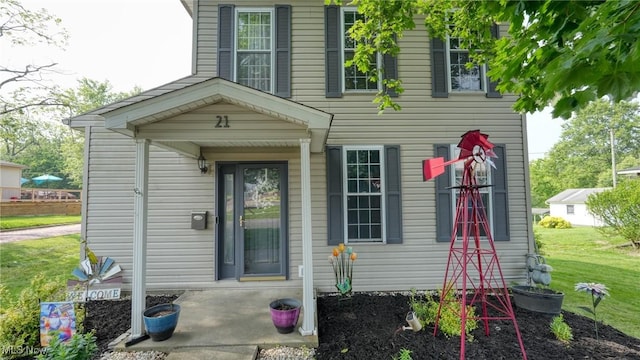21 E Maple Ave, New Concord, OH 43762 - view of front of home featuring a front yard