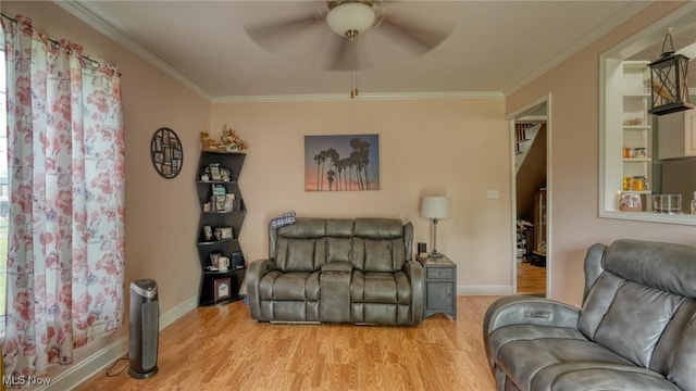 21 E Maple Ave, New Concord, OH 43762 - living area featuring a ceiling fan, light wood-style floors, ornamental molding, and baseboards