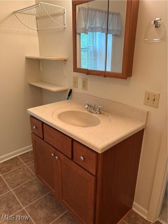 3772 Pershing Ave, Hubbard, OH 44425 - bathroom with vanity, baseboards, and tile patterned flooring