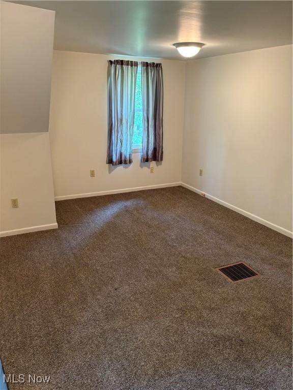 3772 Pershing Ave, Hubbard, OH 44425 - unfurnished room with baseboards and dark colored carpet