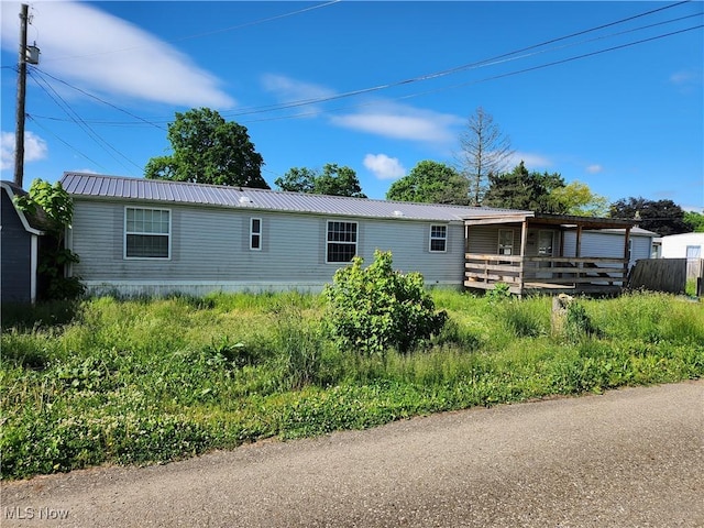 723 Mulvane, Newcomerstown, OH 43832 - back of house featuring metal roof