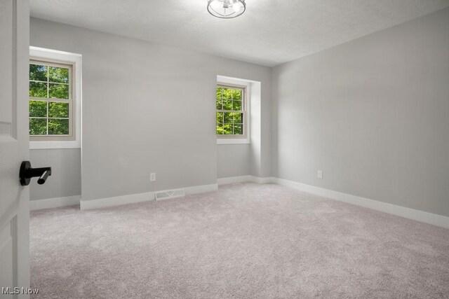 6730 Stone Rd, Medina, OH 44256 - carpeted empty room with a textured ceiling and baseboards