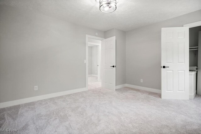 6730 Stone Rd, Medina, OH 44256 - unfurnished bedroom with a textured ceiling, carpet flooring, and baseboards
