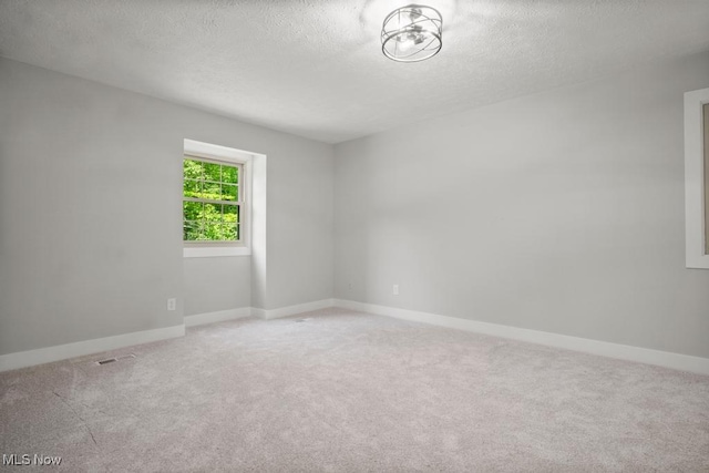6730 Stone Rd, Medina, OH 44256 - empty room with a textured ceiling, carpet floors, and baseboards