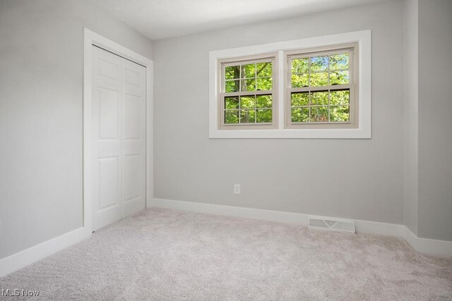 6730 Stone Rd, Medina, OH 44256 - unfurnished bedroom featuring carpet, baseboards, and a closet