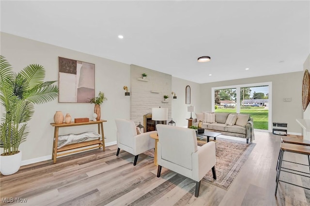 5679 Wilson Mills Rd, Highland Heights, OH 44143 - living room featuring light wood-type flooring, baseboards, and recessed lighting