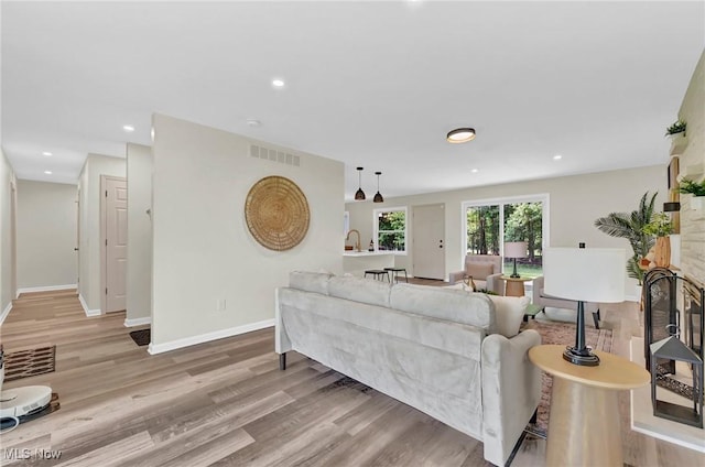 5679 Wilson Mills Rd, Highland Heights, OH 44143 - living area with wood finished floors, baseboards, and recessed lighting