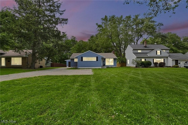 5679 Wilson Mills Rd, Highland Heights, OH 44143 - view of front of property featuring driveway, a front yard, and a chimney