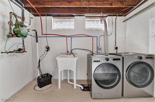 5679 Wilson Mills Rd, Highland Heights, OH 44143 - laundry room featuring washing machine and dryer and concrete block wall
