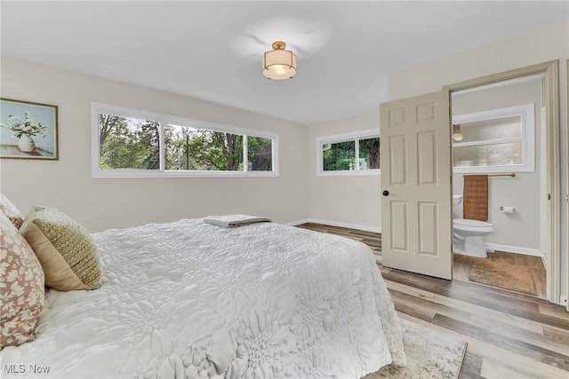 5679 Wilson Mills Rd, Highland Heights, OH 44143 - bedroom featuring wood finished floors, ensuite bath, and baseboards