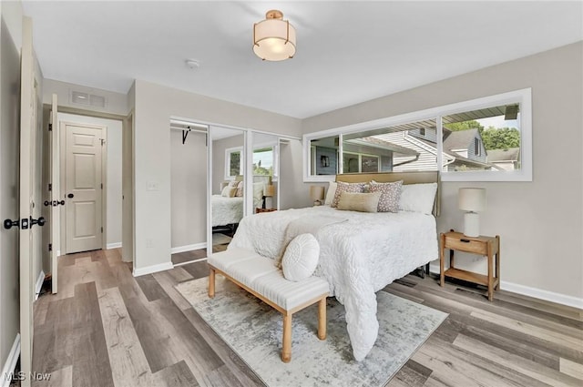 5679 Wilson Mills Rd, Highland Heights, OH 44143 - bedroom with wood finished floors and baseboards