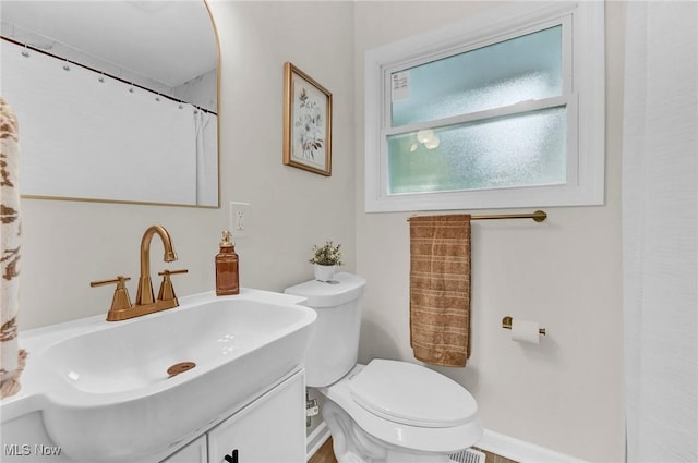 5679 Wilson Mills Rd, Highland Heights, OH 44143 - full bath featuring toilet, vanity, and baseboards