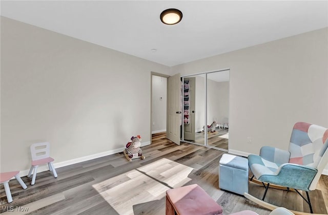 5679 Wilson Mills Rd, Highland Heights, OH 44143 - living area with wood finished floors and baseboards