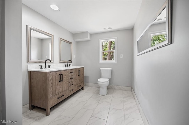 403 Palomino Ct, Lagrange, OH 44050 - full bath with marble finish floors, double vanity, toilet, and baseboards