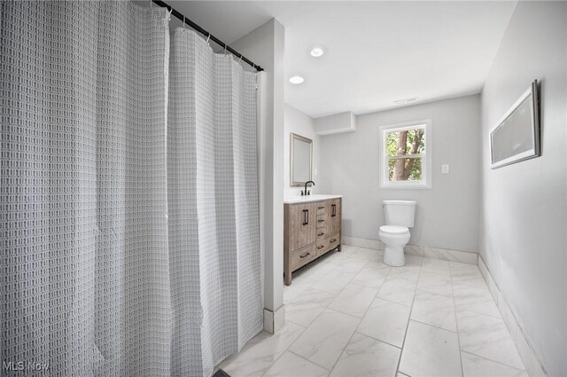 403 Palomino Ct, Lagrange, OH 44050 - bathroom featuring marble look tiles, toilet, vanity, and baseboards