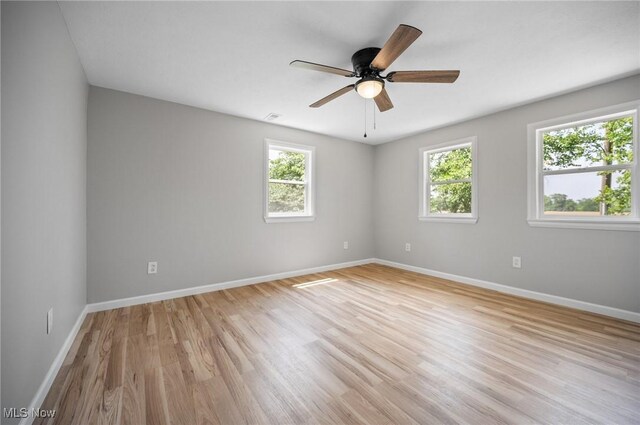 403 Palomino Ct, Lagrange, OH 44050 - unfurnished room featuring light wood-style floors, baseboards, and ceiling fan