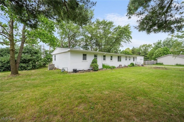 403 Palomino Ct, Lagrange, OH 44050 - rear view of house with a lawn