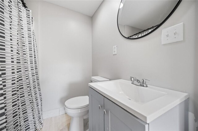 403 Palomino Ct, Lagrange, OH 44050 - bathroom with toilet, vanity, and a shower with shower curtain