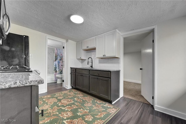 20969 Stanford, Fairview Park, OH 44126 - kitchen featuring freestanding refrigerator, dark wood-style flooring, baseboards, backsplash, and white cabinets