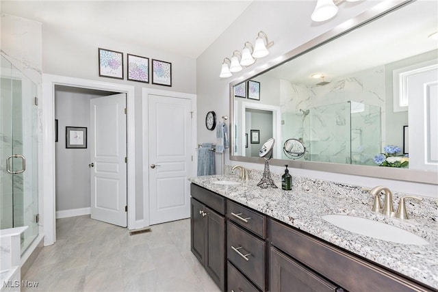 660 Shinnecock Ln, Aurora, OH 44202 - bathroom with a marble finish shower, double vanity, baseboards, and marble look tile flooring