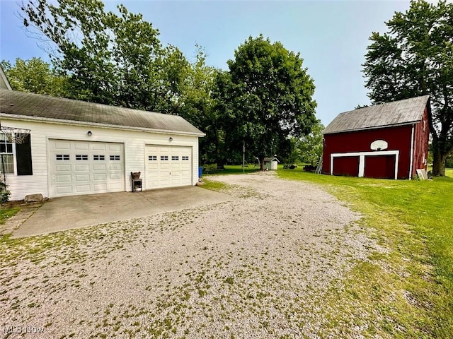184 W Jefferson St, Jefferson, OH 44047 - detached garage featuring driveway