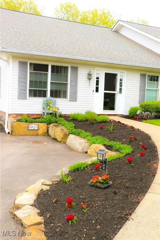 682 2nd St Unit 1, Fairport Harbor, OH 44077 - view of front of property featuring roof with shingles