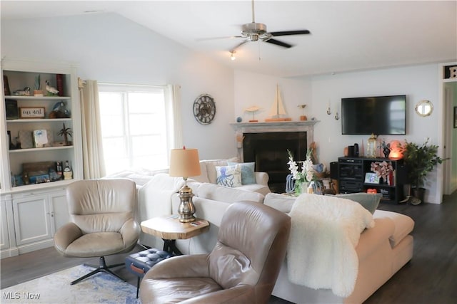 682 2nd St Unit 1, Fairport Harbor, OH 44077 - living room with wood finished floors, lofted ceiling, ceiling fan, and a fireplace