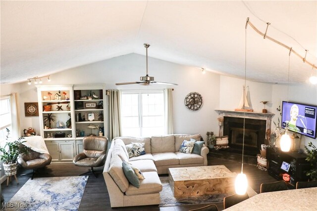 682 2nd St Unit 1, Fairport Harbor, OH 44077 - living room featuring healthy amount of natural light, a fireplace, wood finished floors, a ceiling fan, and lofted ceiling