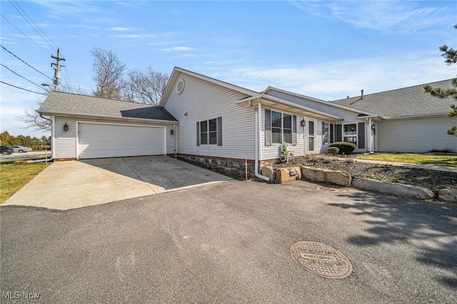 682 2nd St Unit 1, Fairport Harbor, OH 44077 - view of front of property featuring driveway and a garage