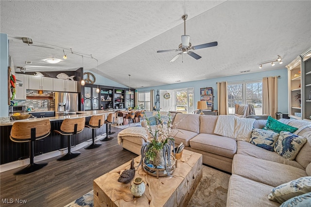 682 2nd St Unit 1, Fairport Harbor, OH 44077 - living room with track lighting, a textured ceiling, dark wood finished floors, lofted ceiling, and a ceiling fan