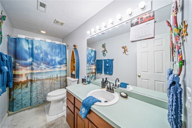 682 2nd St Unit 1, Fairport Harbor, OH 44077 - full bathroom with toilet, vanity, tile patterned floors, a textured ceiling, and a shower with curtain
