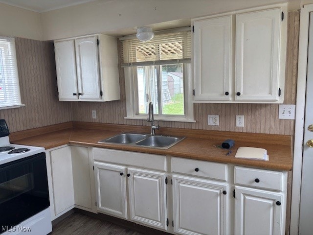 107 Mcdonald, Niles, OH 44446 - kitchen with electric range, a sink, white cabinets, and dark wood-style floors